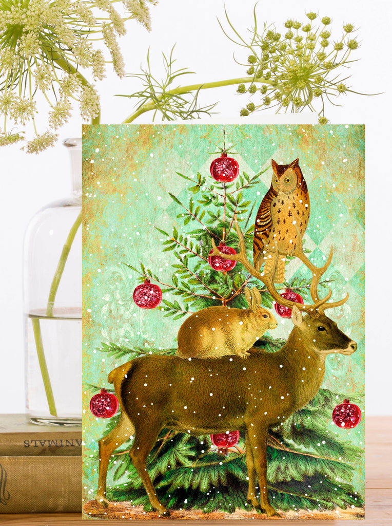Decorative card with deer, owl, and Christmas tree design on a light green background.