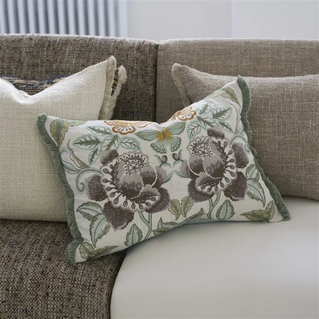 Isabella embroidered cameo pillow on couch with  linen textured pillows
