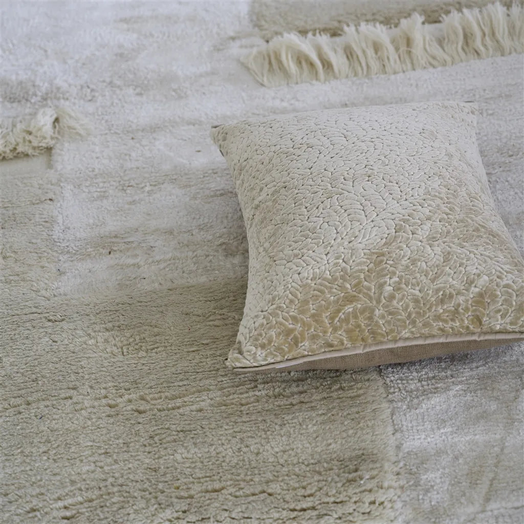 Cartouche Linen Pillow on rug 