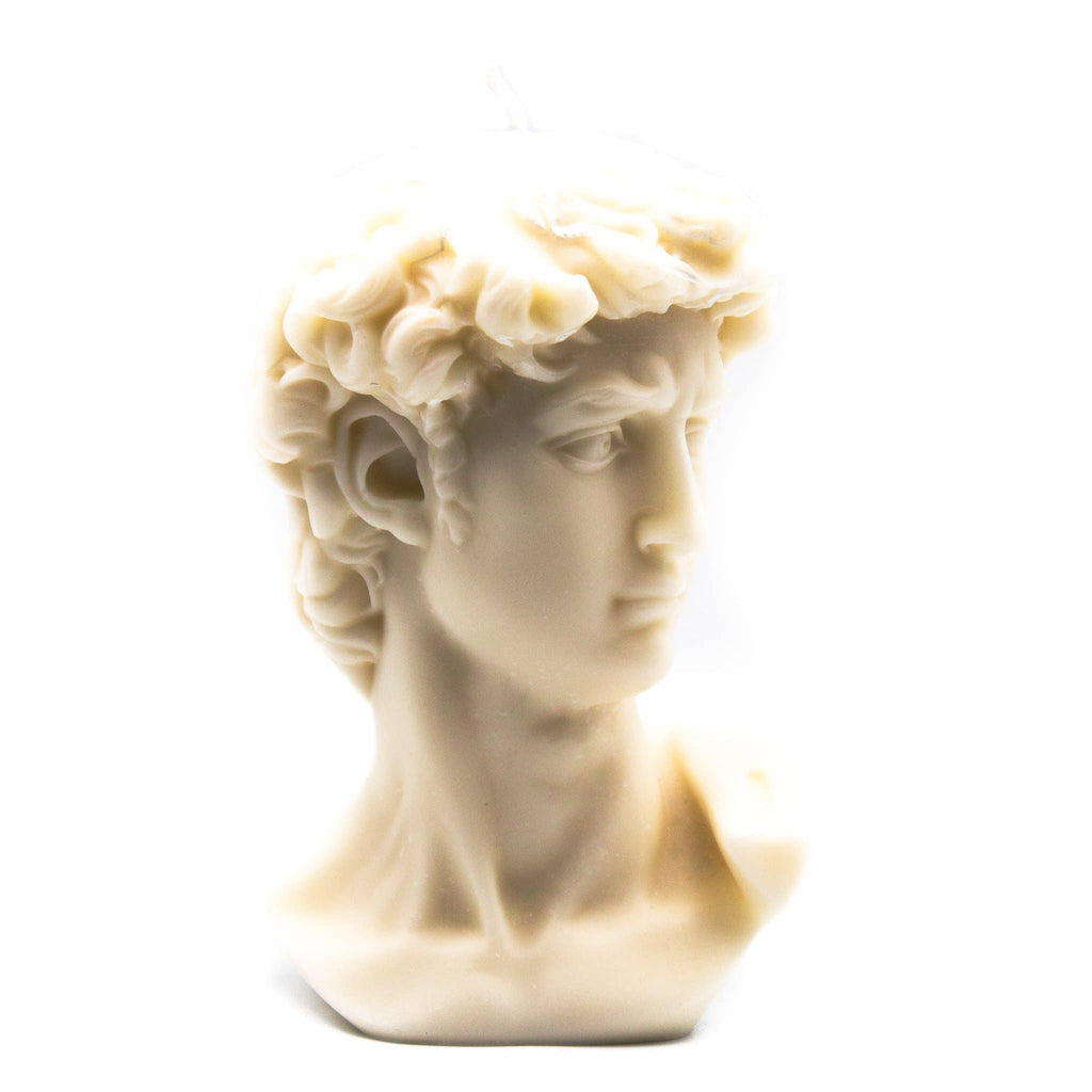Candle bust of a classical figure with a white background