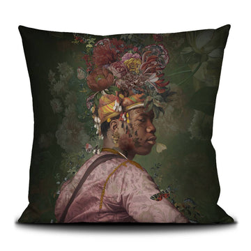 Decorative pillow with a stylized portrait of a man wearing a floral headpiece on a dark background.