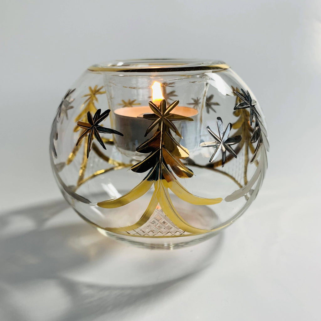 Decorative clear glass candle holder with gold tree designs 