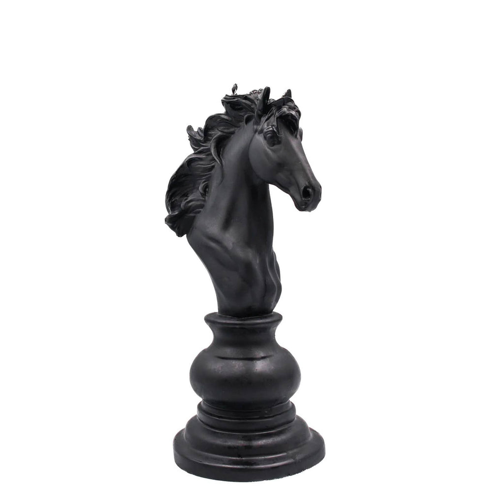 Black horse head candle on a white background