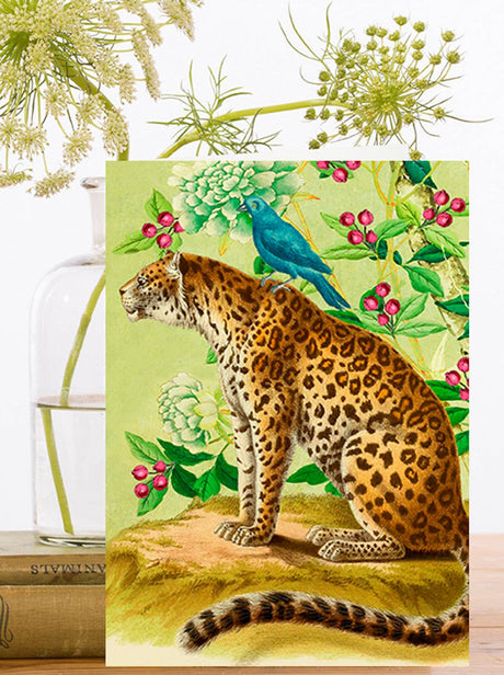 Greeting card with illustration of a leopard with a blue bird on a floral background