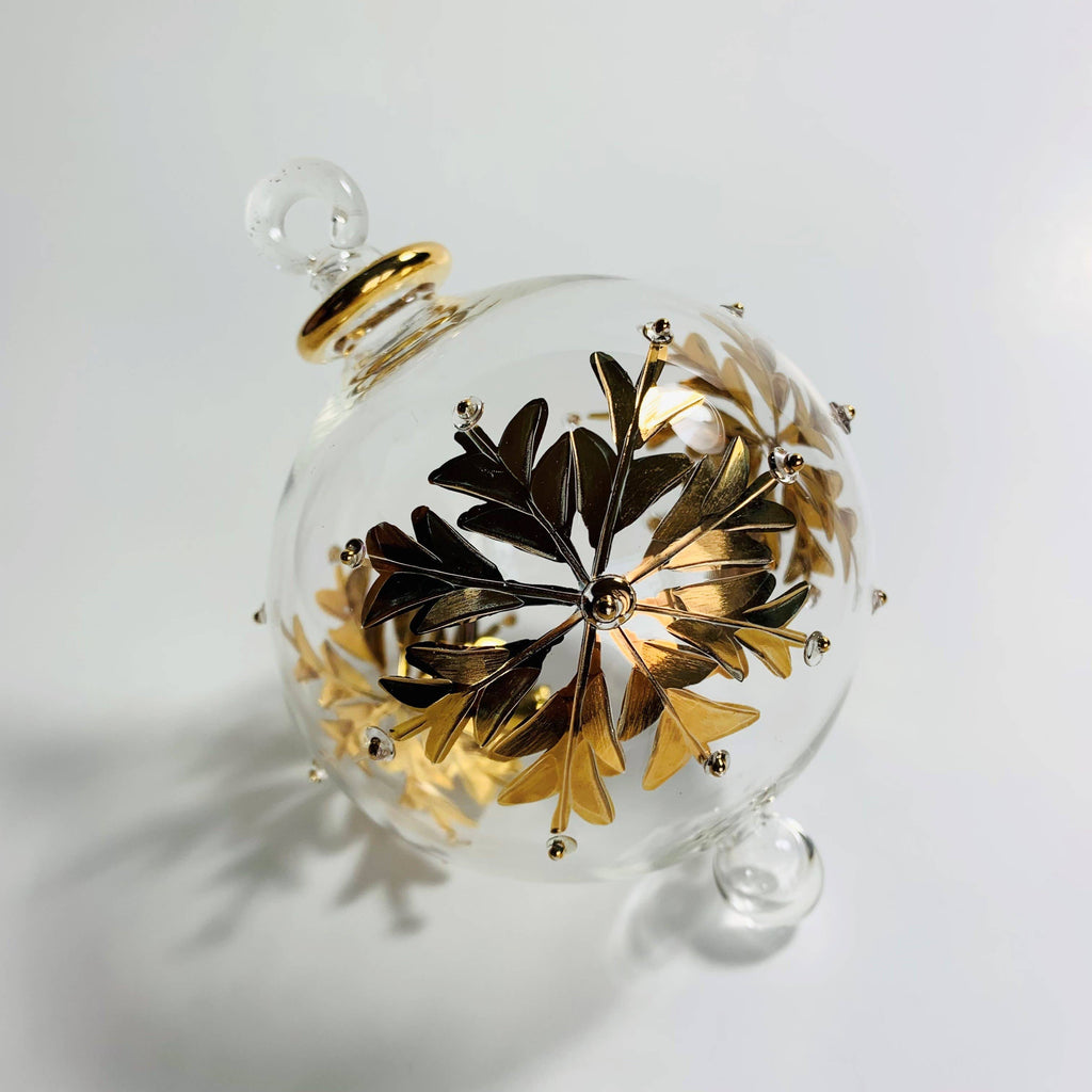 Clear glass ornament with gold leaf design 