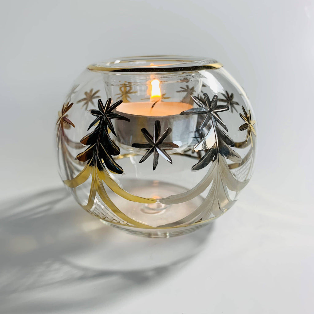 Decorative clear glass candle holder with gold tree designs 