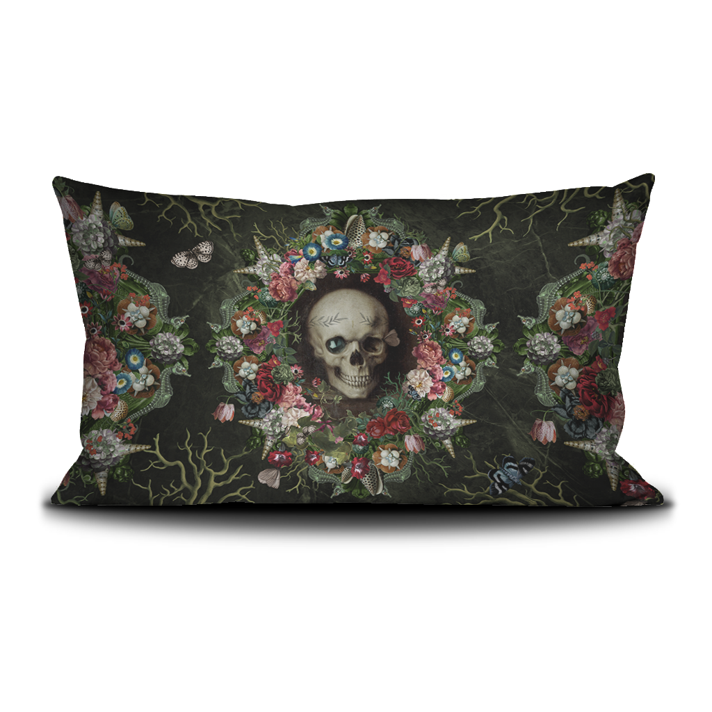 Decorative pillow with a skull and floral design on a black background