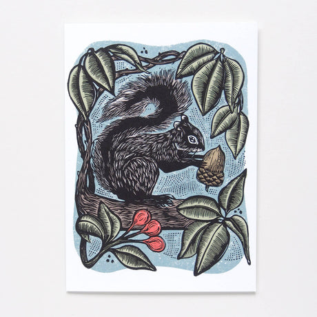 A vertical art print featuring a detailed black and gray illustration of a squirrel holding an acorn, surrounded by green leaves and small red berries on a light blue dotted background, set against a clean white backdrop.