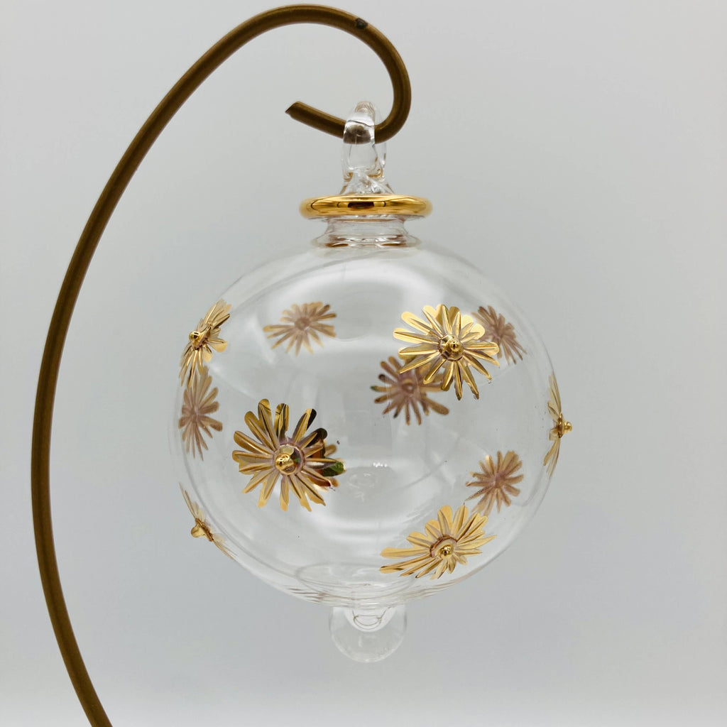Clear glass ornament with gold floral designs 