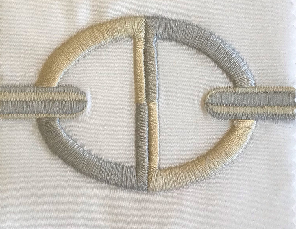 Close up of the Chaine Embroidery in White/ Sand 