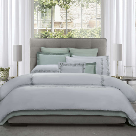 Annabella Embroidered Duvet Cover and Shams set up on the bed 