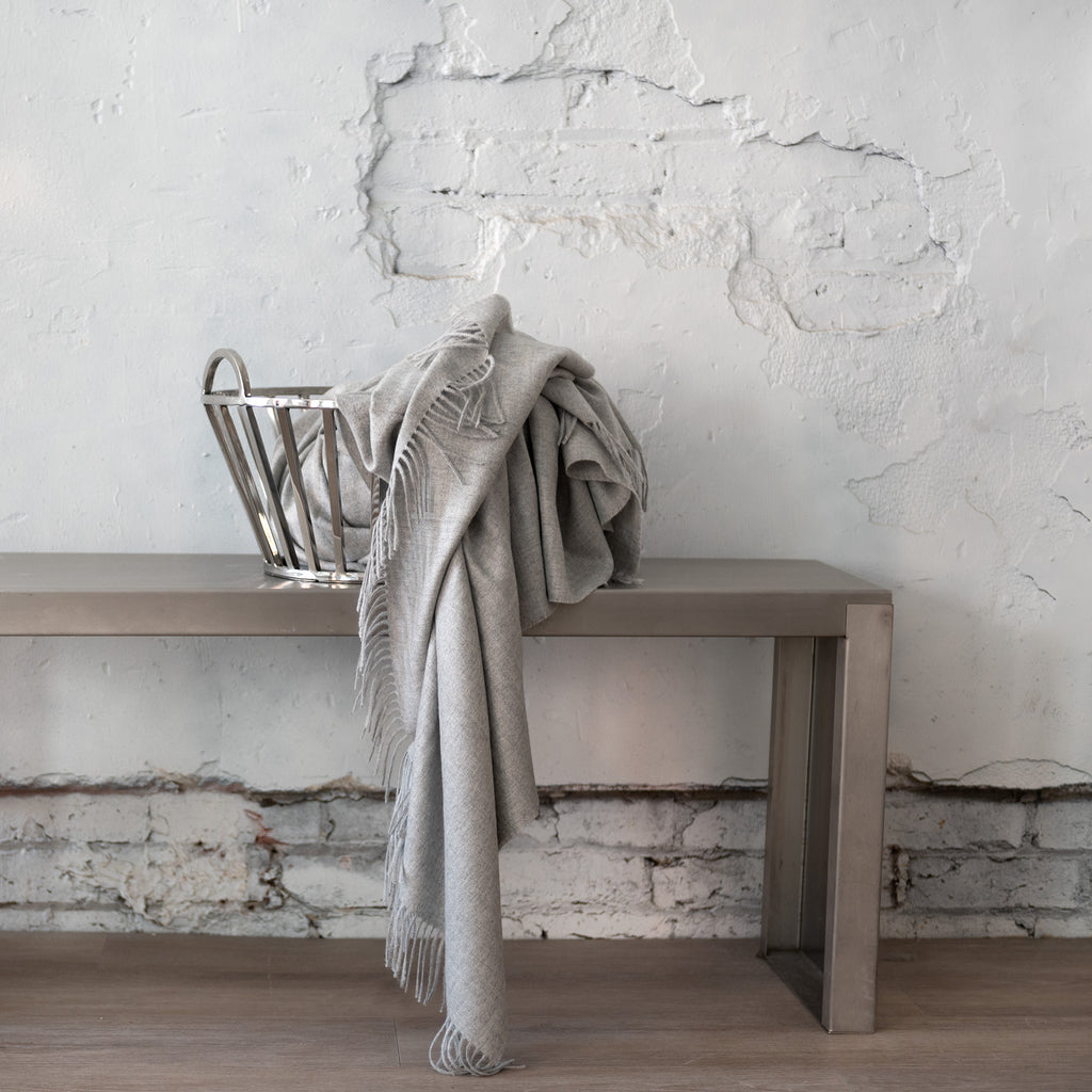 Alfie Mist throw draped in metal basket