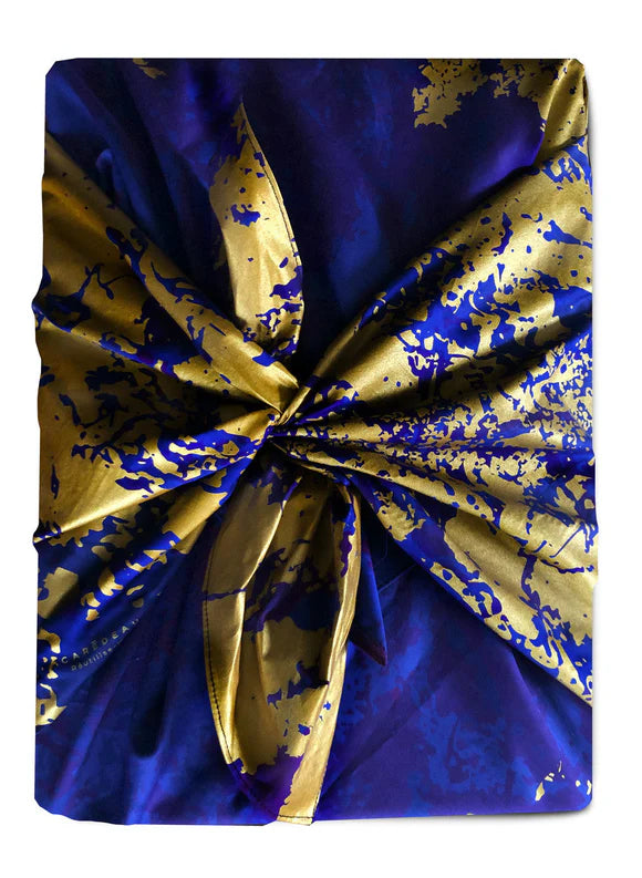 Sustainable and reusable cotton gift wrap with a timeless patterned design