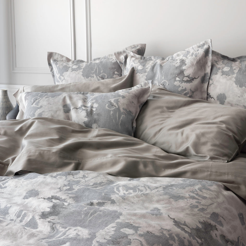 Blossom Moonlight bedding with duvet cover and shams. Paired with Capri Platinum flatsheet and pillowcases.