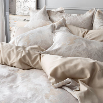 Blossom Parchment bedidng diplay with duvet cover, shams. Capri Sand pillowcases. 