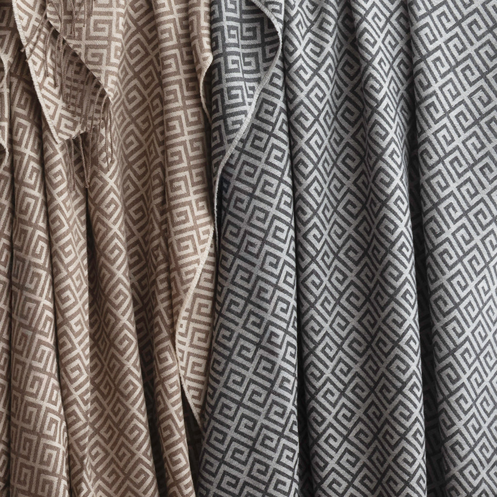 Bruno throw in the colour Almond (left) and Charcoal (right)