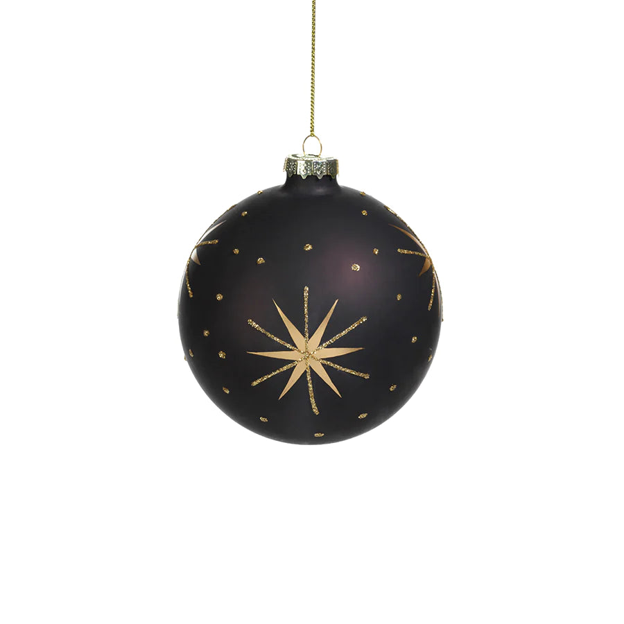 Gold and Black Star Design Ornament hanging on a gold string 