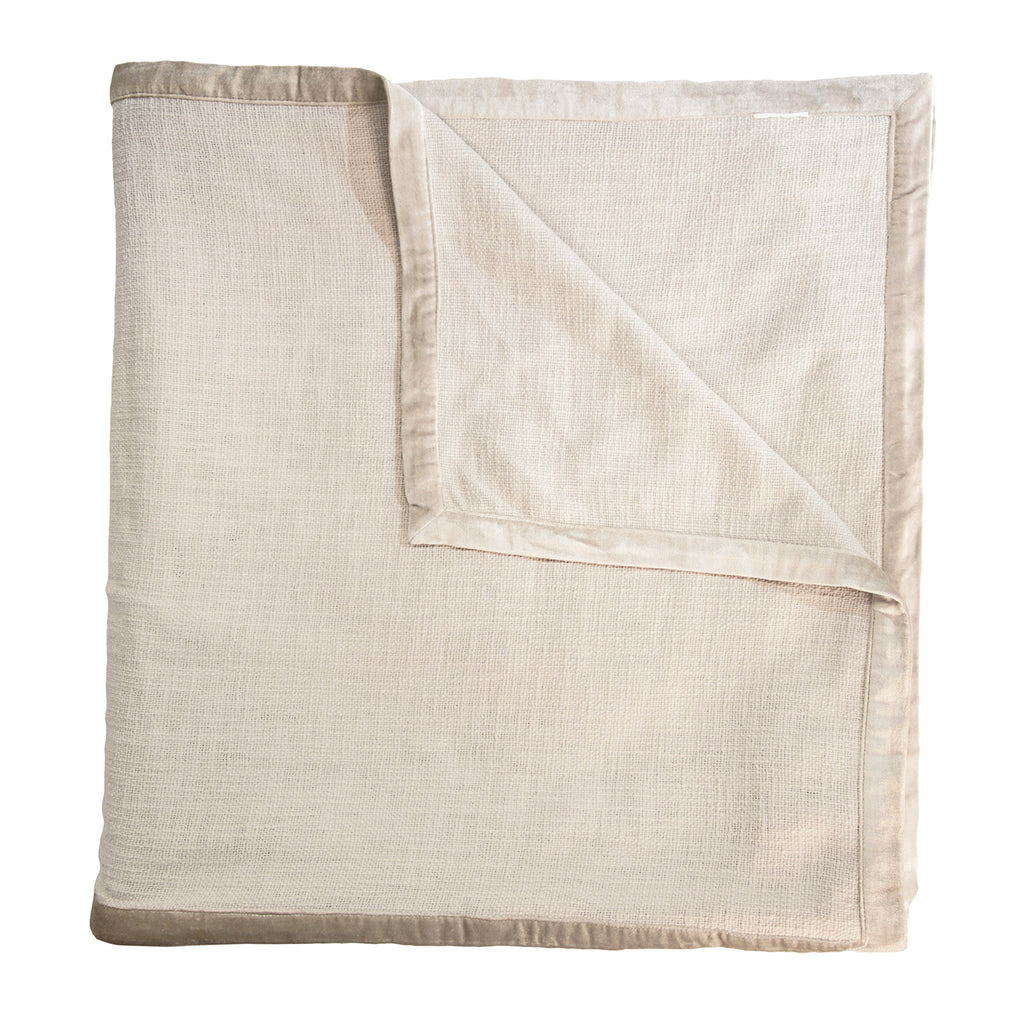 Biscotti chunky woven coverlet shown folded with one corner turned back.