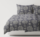 Dast Navy textured bedding set on a bed 