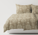 Light brown textured bedding set on a bed