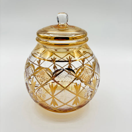 Decorative glass jar with gold embellishments