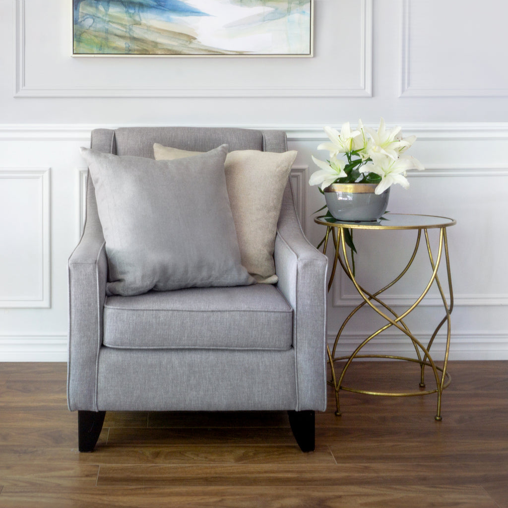 Forrte Grey and Forte Natural cushions on armchair