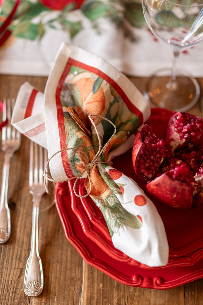 A red napkin with a Christmas-themed pattern 