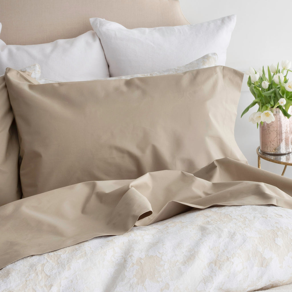 Hotel Roma Biscotti Sheets - crisp looking warm beige coloured top sheet and pillowcase on bed with neutral coloured textured duvet cover and shams.