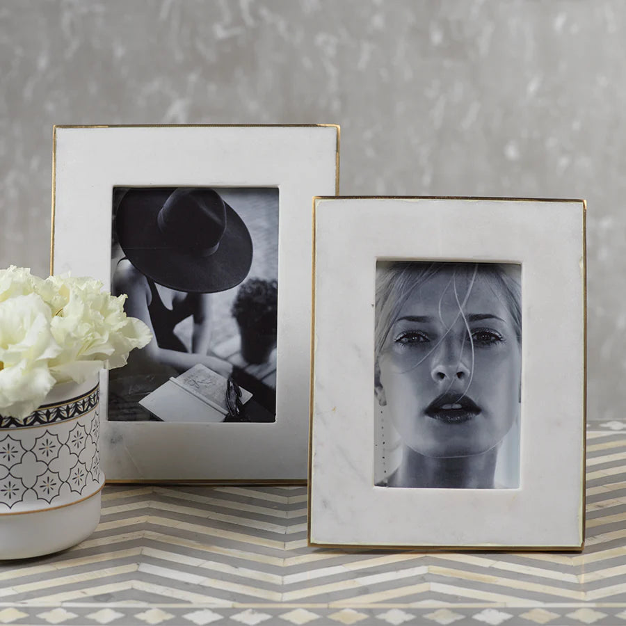 Marmo Marble Photo Frames on zigzag inlay surface with vase with flowers in on the left hand side