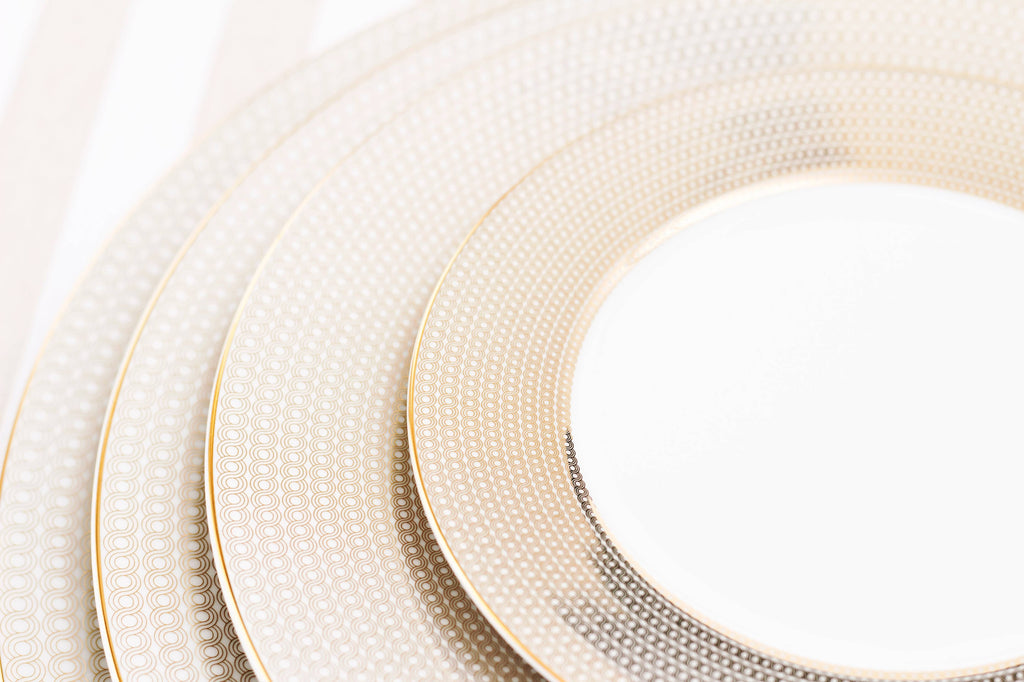 Set of white plates with gold rims
