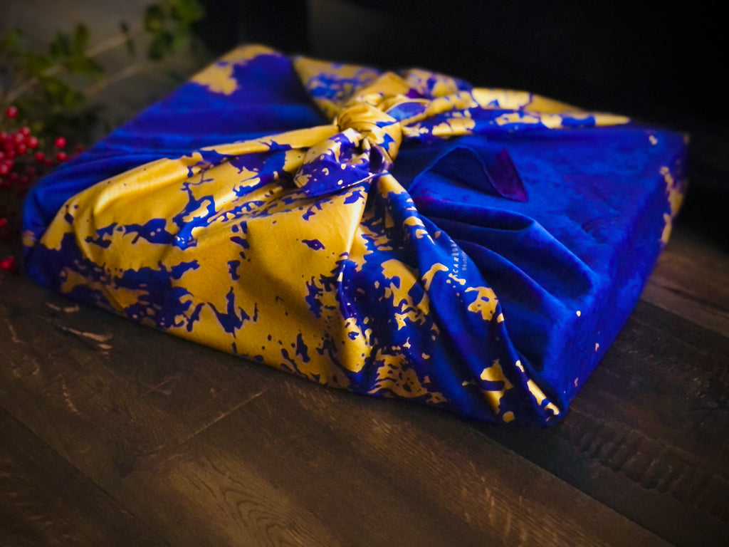 Sustainable and reusable cotton gift wrap with a timeless patterned design