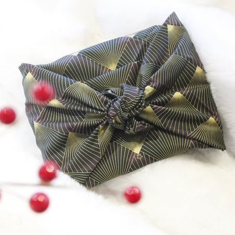 Sustainable and reusable cotton gift wrap with a timeless patterned design