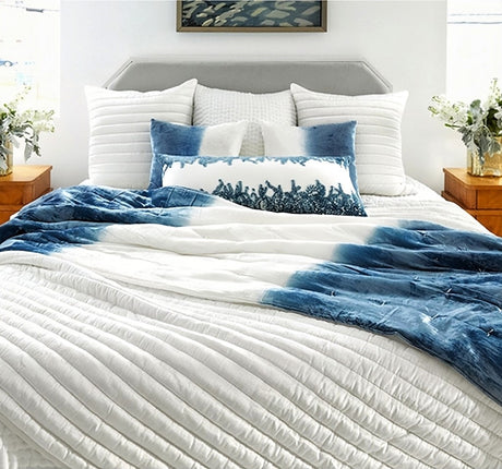 White Channel Velvet Quilted coverlet and shams on the bed