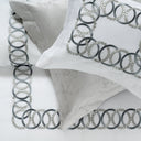 White Sham with decorative grey embroidery on a white background