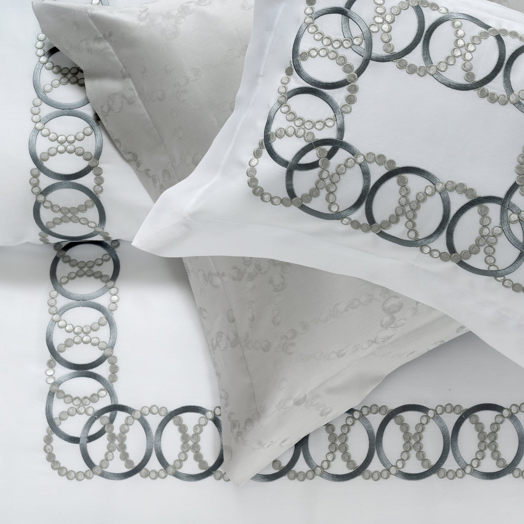 White Sham with decorative grey embroidery on a white background