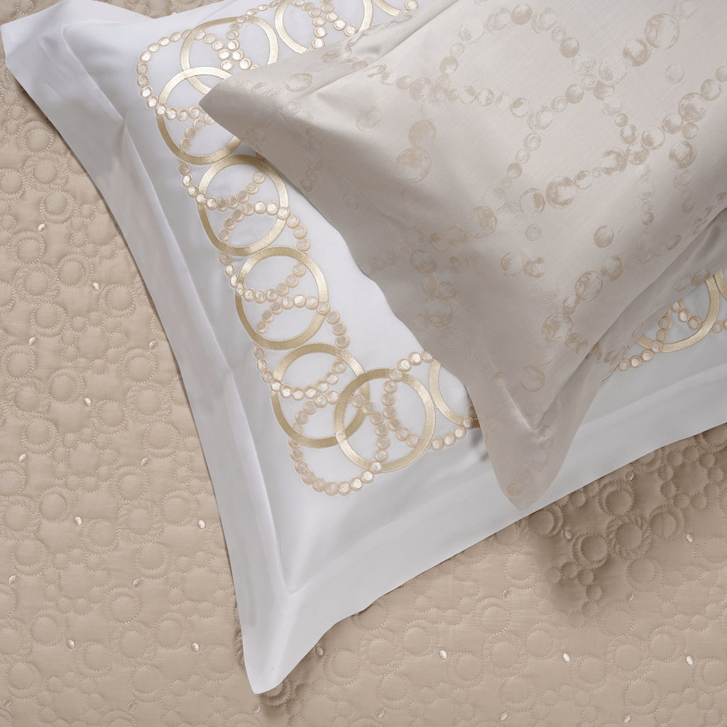 White Sham with decorative gold tone embroidery on a white background