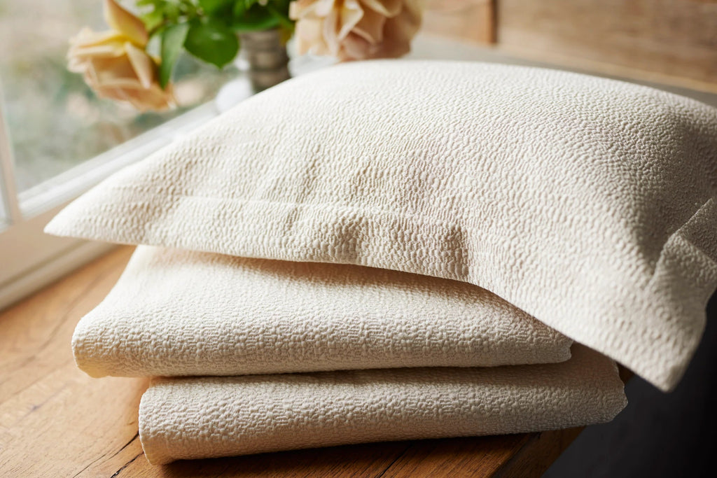 Sham and folded coverlet in light beige colour 