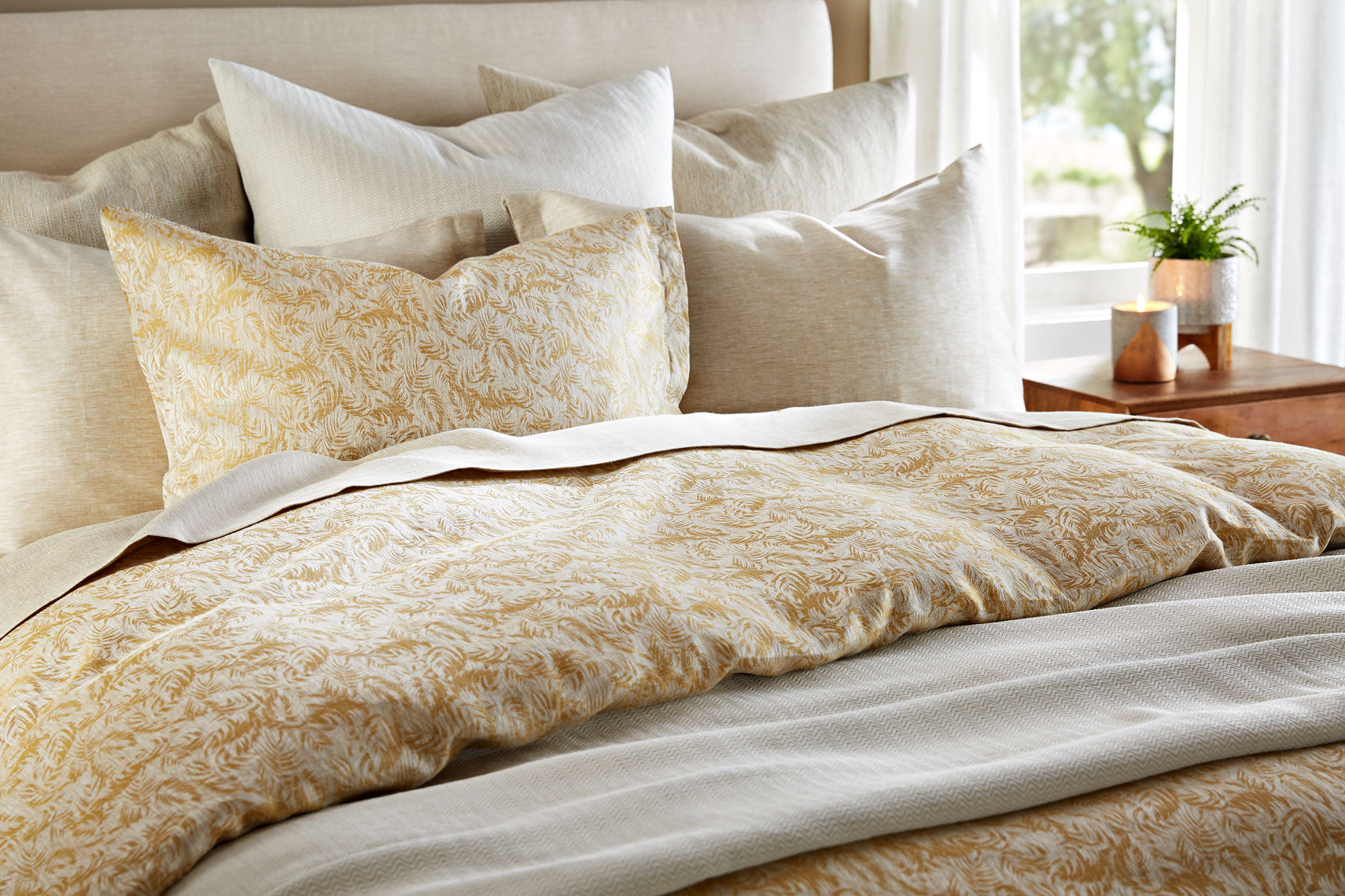 York Dijon bedding shown on bed with coordinating other bedding