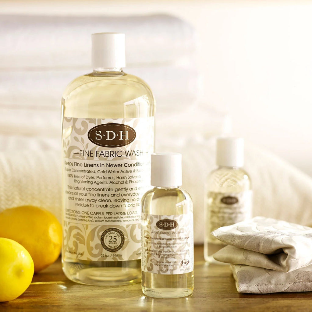 A bottle of SDH Fine Fabric Wash laundry detergent 