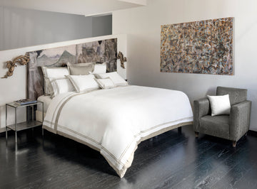Sinfonia White/ Khaki bedding in bedroom with modern art