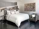 Sinfonia White/ Silver Moon bedding in bedroom with modern art