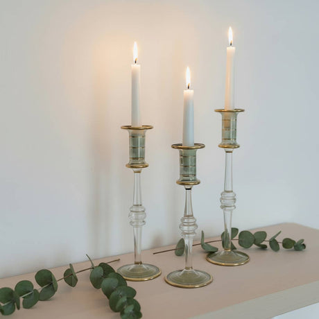 Set of three glass candle holders with gold finishing 