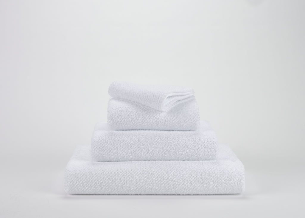 Abyss Twill white towels in a stack