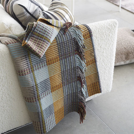 Throw is mixed in blue, orange and green colours 