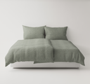Pale Green textured bedding set up on a bed