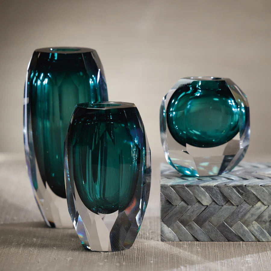  Trio of Aman cut glass vases shown together with small vase on decorative block to the right, medium vase in centre and large vase on the right