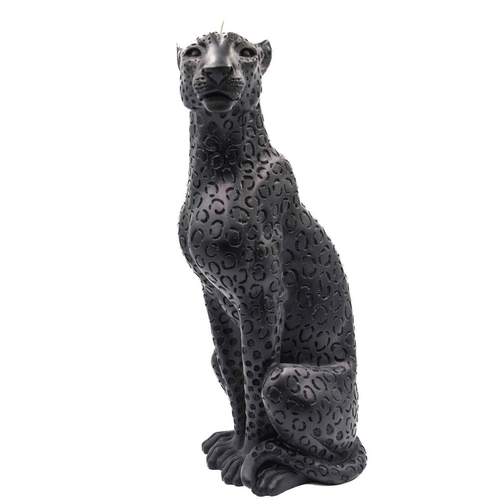 Black jaguar candle against white background