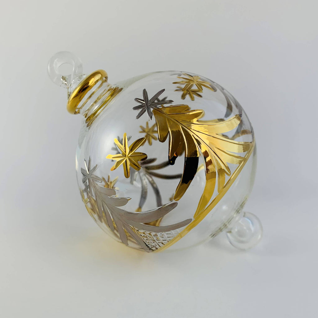 Decorative glass ornament with gold and silver tree and star designs