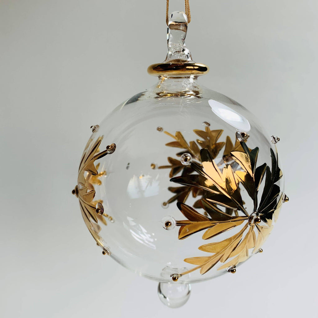 Clear glass ornament with gold leaf design 