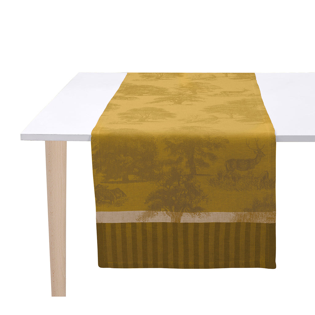 Souveraine Gold runner shown on white table